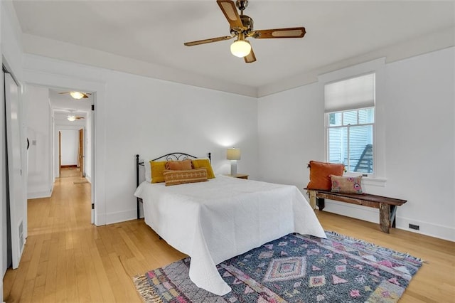 bedroom featuring light wood-type flooring and ceiling fan