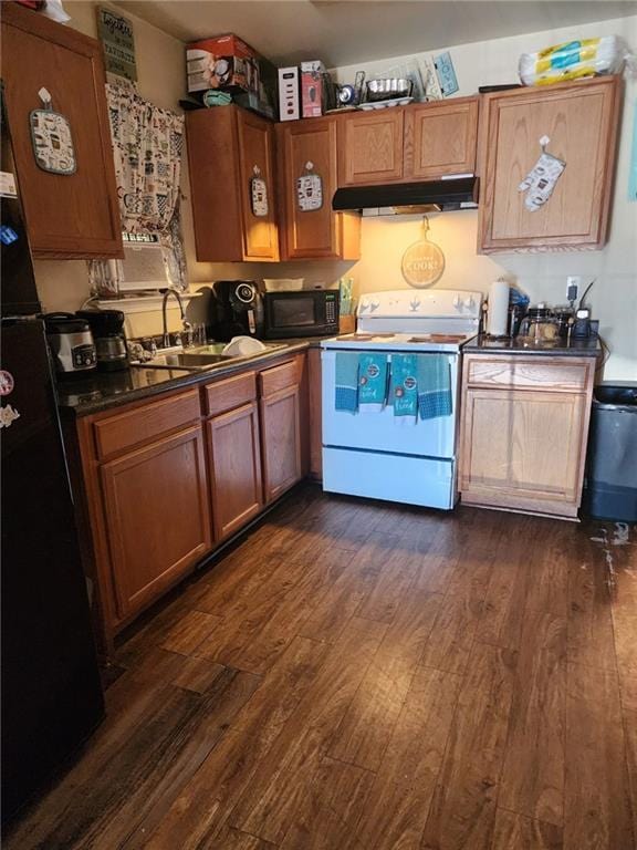 kitchen with black appliances, dark hardwood / wood-style floors, and sink