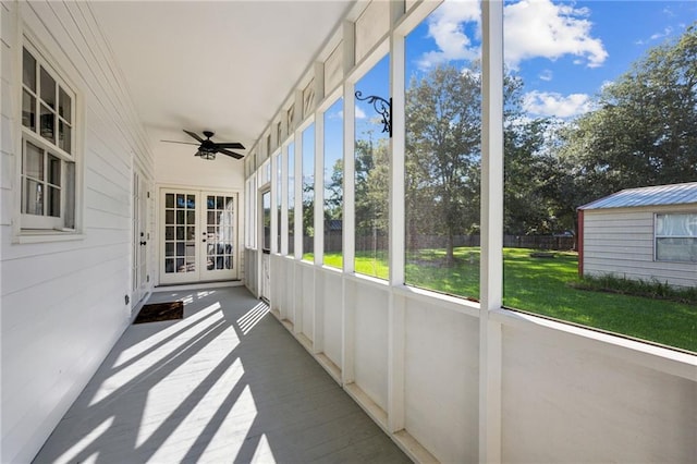 unfurnished sunroom with french doors, ceiling fan, and a healthy amount of sunlight