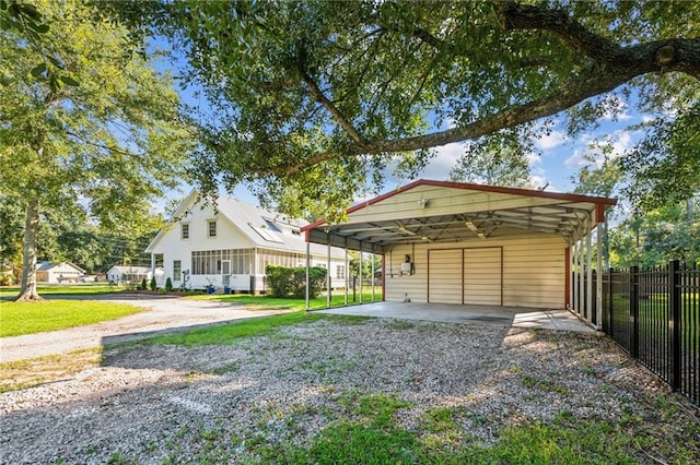 view of front facade with a carport