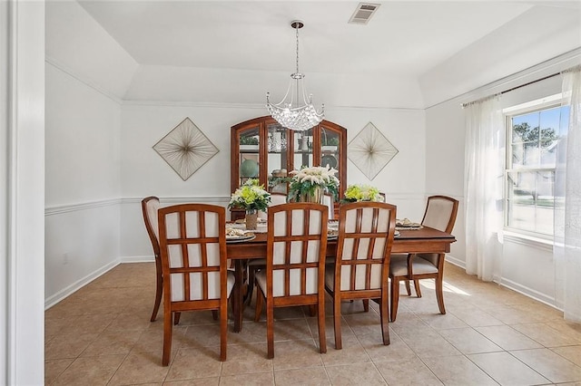 dining room with baseboards, light tile patterned flooring, visible vents, and an inviting chandelier