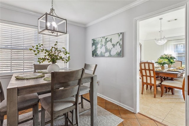 dining space with a chandelier, ornamental molding, light tile patterned floors, and visible vents