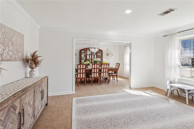 dining space featuring ornamental molding, visible vents, baseboards, and light tile patterned floors