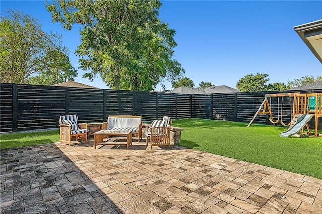 view of patio / terrace with playground community, a fenced backyard, and an outdoor hangout area