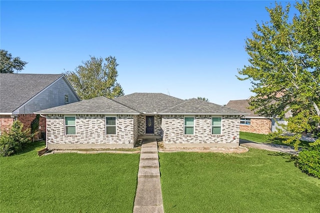 ranch-style home featuring a front yard