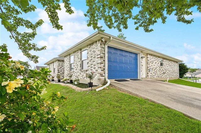 204 Chubasco Ln, Slidell, LA 70458 - view of property exterior featuring asphalt driveway, an attached garage, and a lawn
