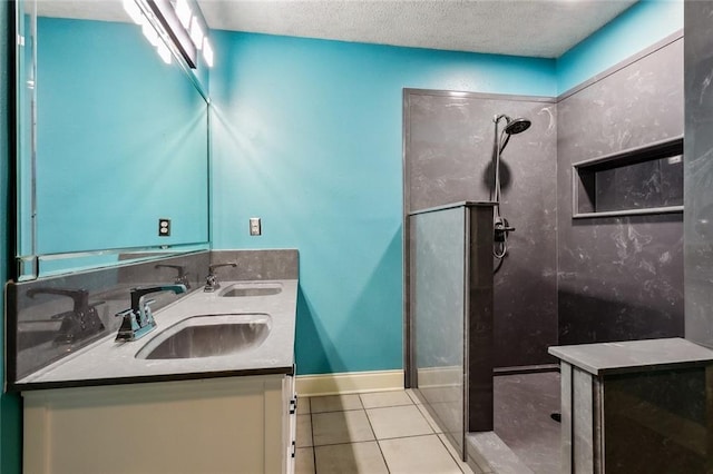 204 Chubasco Ln, Slidell, LA 70458 - full bath with walk in shower, double vanity, tile patterned flooring, baseboards, and a textured ceiling
