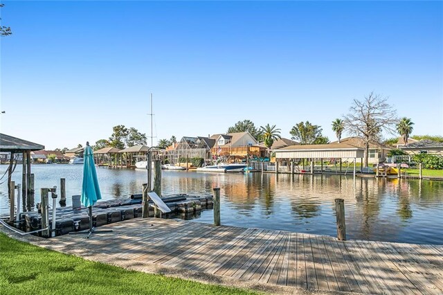 204 Chubasco Ln, Slidell, LA 70458 - dock area featuring a residential view, a water view, and boat lift