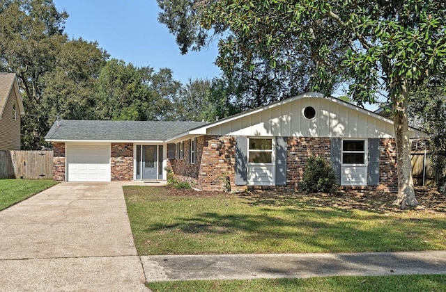 ranch-style home with a garage and a front lawn