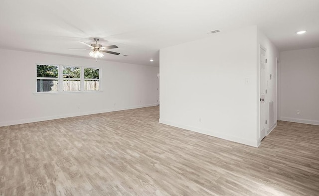 unfurnished room featuring light hardwood / wood-style flooring and ceiling fan