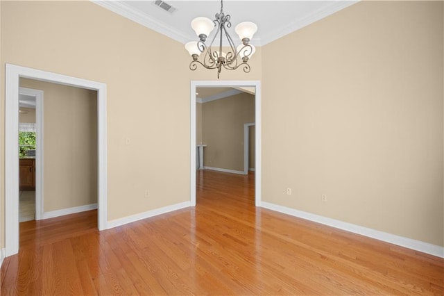 unfurnished dining area featuring a notable chandelier, ornamental molding, and hardwood / wood-style flooring