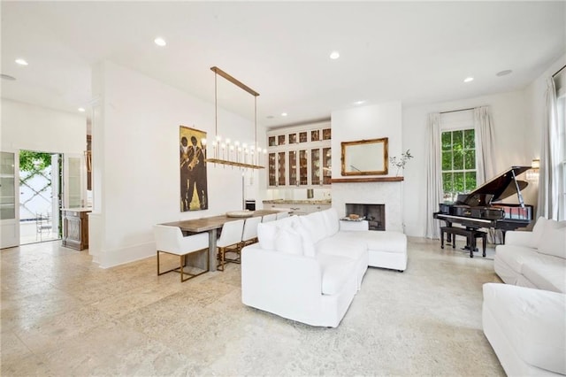 living room featuring a notable chandelier