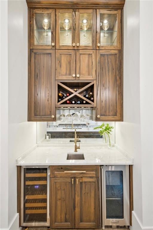 bar with wine cooler, sink, and backsplash