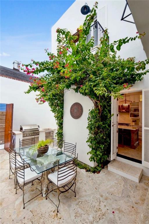 view of patio / terrace featuring area for grilling and outdoor dining area