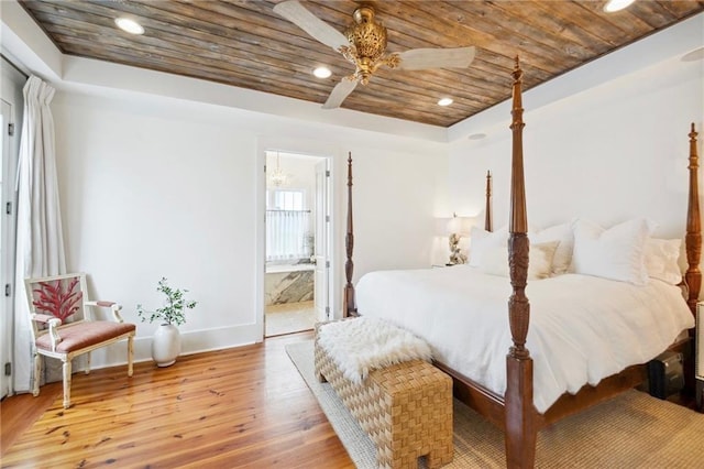 bedroom with light hardwood / wood-style flooring, wood ceiling, ensuite bath, and ceiling fan