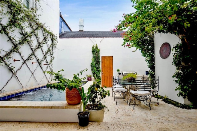 view of patio featuring a grill