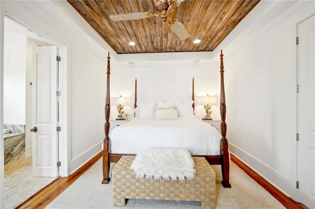 bedroom with recessed lighting, wooden ceiling, baseboards, and light wood-style floors