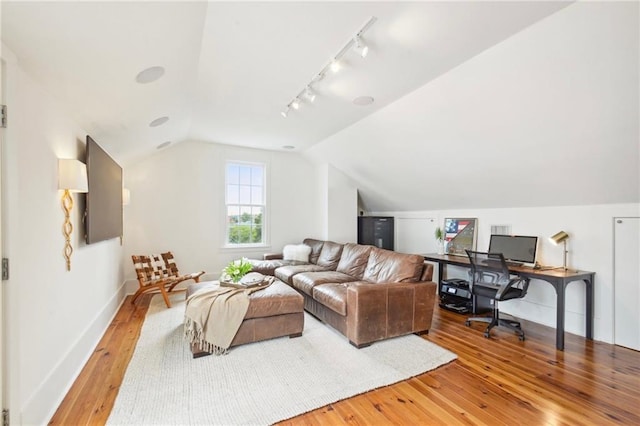 living room with lofted ceiling and hardwood / wood-style flooring