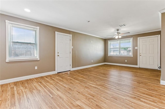 369 Pat Dr, Avondale, LA 70094 - empty room with visible vents, baseboards, ceiling fan, crown molding, and light wood finished floors