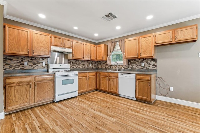 369 Pat Dr, Avondale, LA 70094 - kitchen with visible vents, white appliances, light wood-style floors, and under cabinet range hood