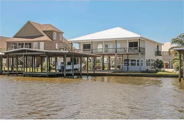 rear view of house with a water view