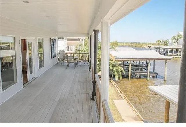 wooden terrace with a water view