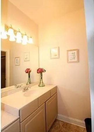 bathroom with tile patterned flooring and vanity