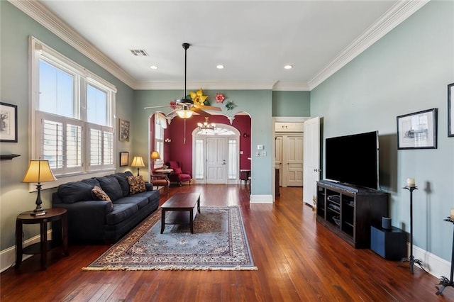 living room with ornamental molding and dark wood-type flooring