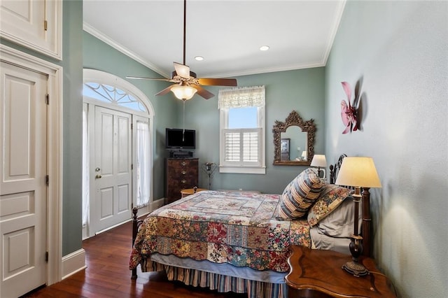 bedroom with ceiling fan, crown molding, dark wood-type flooring, and multiple windows