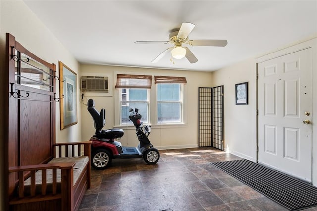 entrance foyer with ceiling fan and a wall mounted air conditioner