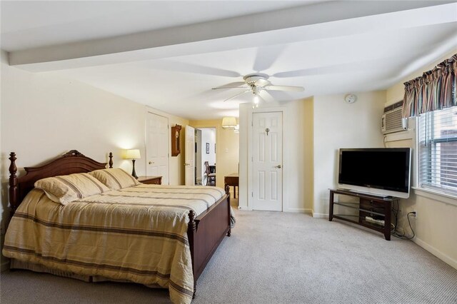 bedroom with light carpet, an AC wall unit, beamed ceiling, and ceiling fan