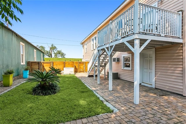 view of yard featuring a deck and a patio