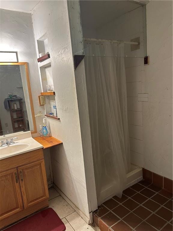 bathroom with vanity, tile patterned floors, and a shower with shower curtain