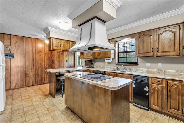 kitchen featuring a kitchen island, wooden walls, black appliances, sink, and island exhaust hood