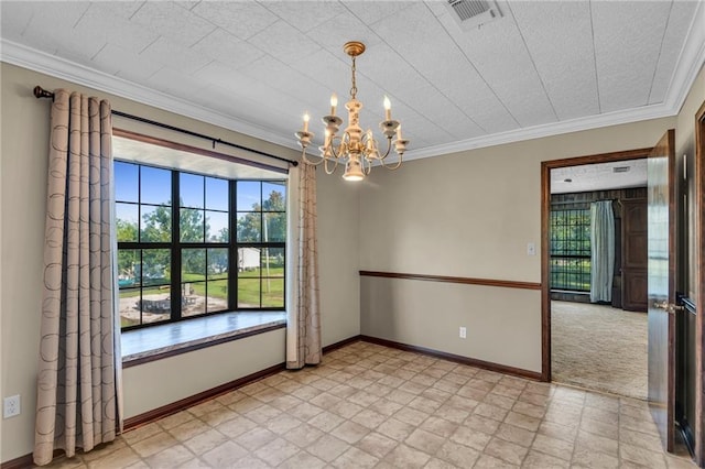 empty room featuring light colored carpet, a textured ceiling, crown molding, and a chandelier