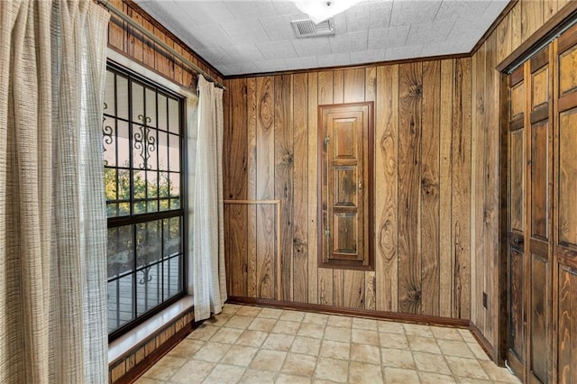 doorway featuring wood walls