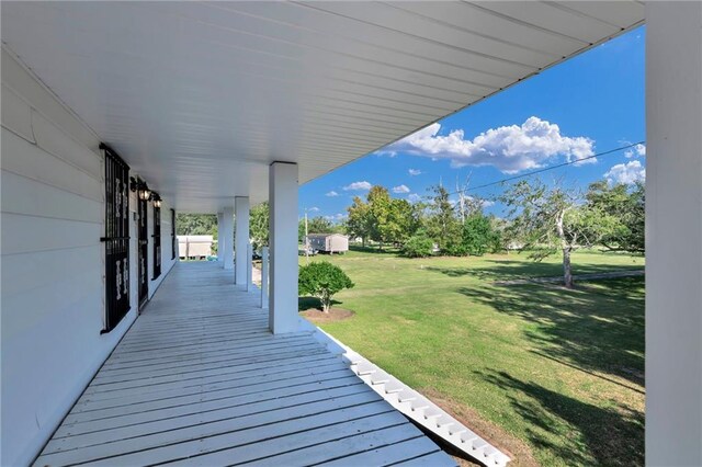 deck featuring a lawn