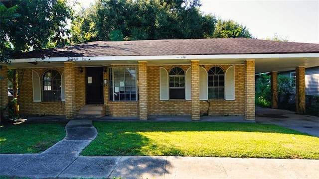 1321 Pacific Ave, New Orleans, LA 70114 - view of front of property with a front lawn, brick siding, a carport, and a porch