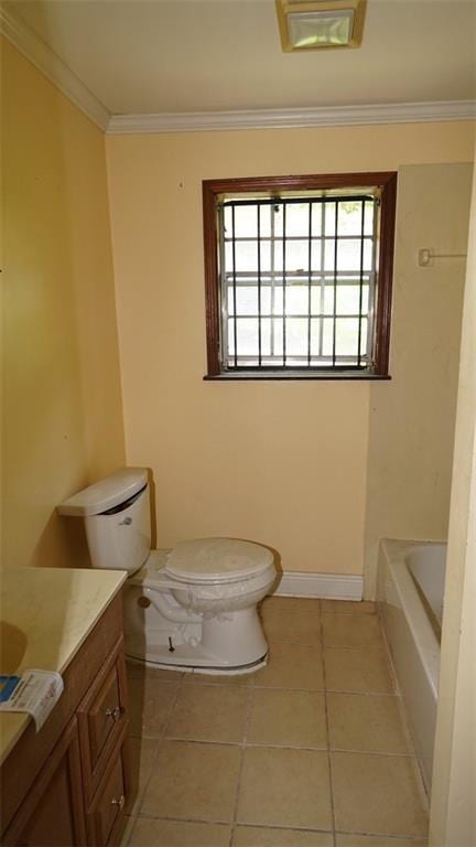 bathroom featuring vanity, a bath, crown molding, tile patterned flooring, and toilet