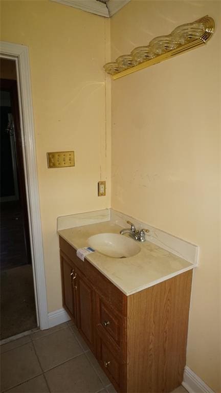 bathroom featuring tile patterned flooring and vanity