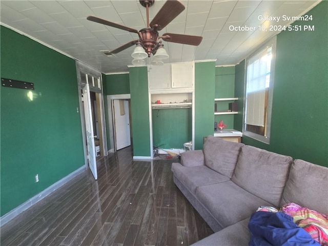 unfurnished living room with crown molding, dark hardwood / wood-style flooring, and ceiling fan