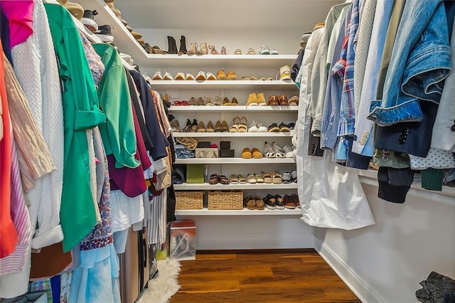 walk in closet featuring dark wood-type flooring