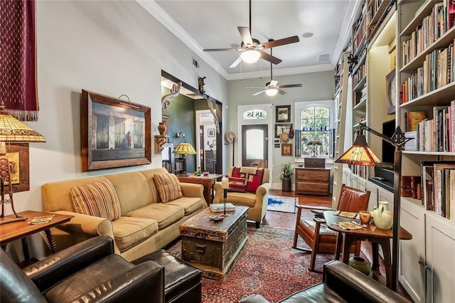 living area featuring visible vents, ornamental molding, and a ceiling fan