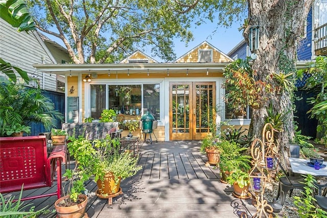 property entrance featuring a deck and french doors