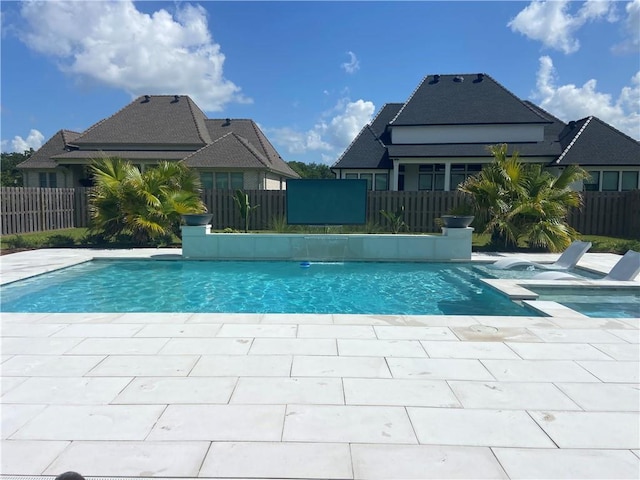 view of swimming pool featuring a patio area, a fenced in pool, and fence