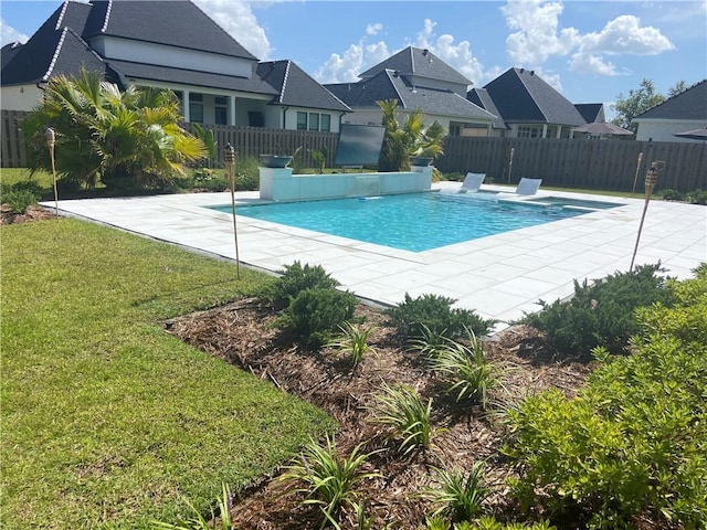 view of swimming pool featuring a residential view, a fenced in pool, a yard, and fence