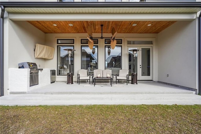 view of patio / terrace with area for grilling and french doors