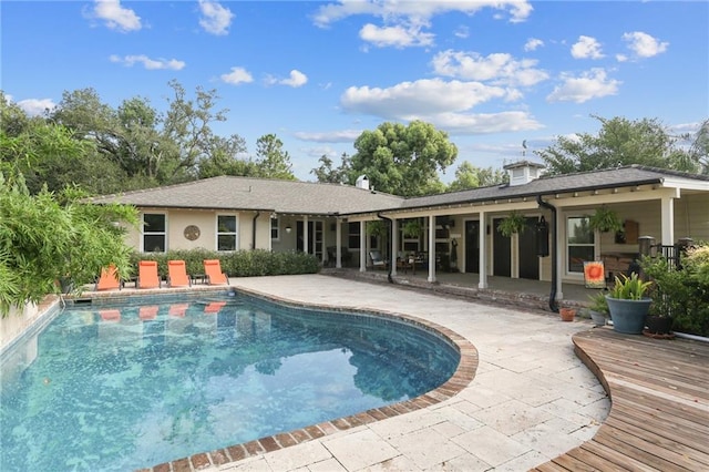 view of swimming pool with a patio area