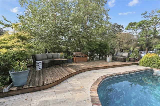 view of pool featuring outdoor lounge area and a deck