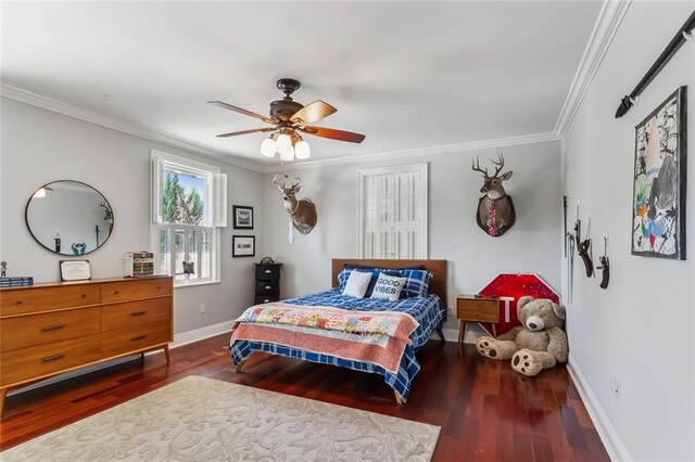 bedroom with ornamental molding, ceiling fan, and dark hardwood / wood-style flooring